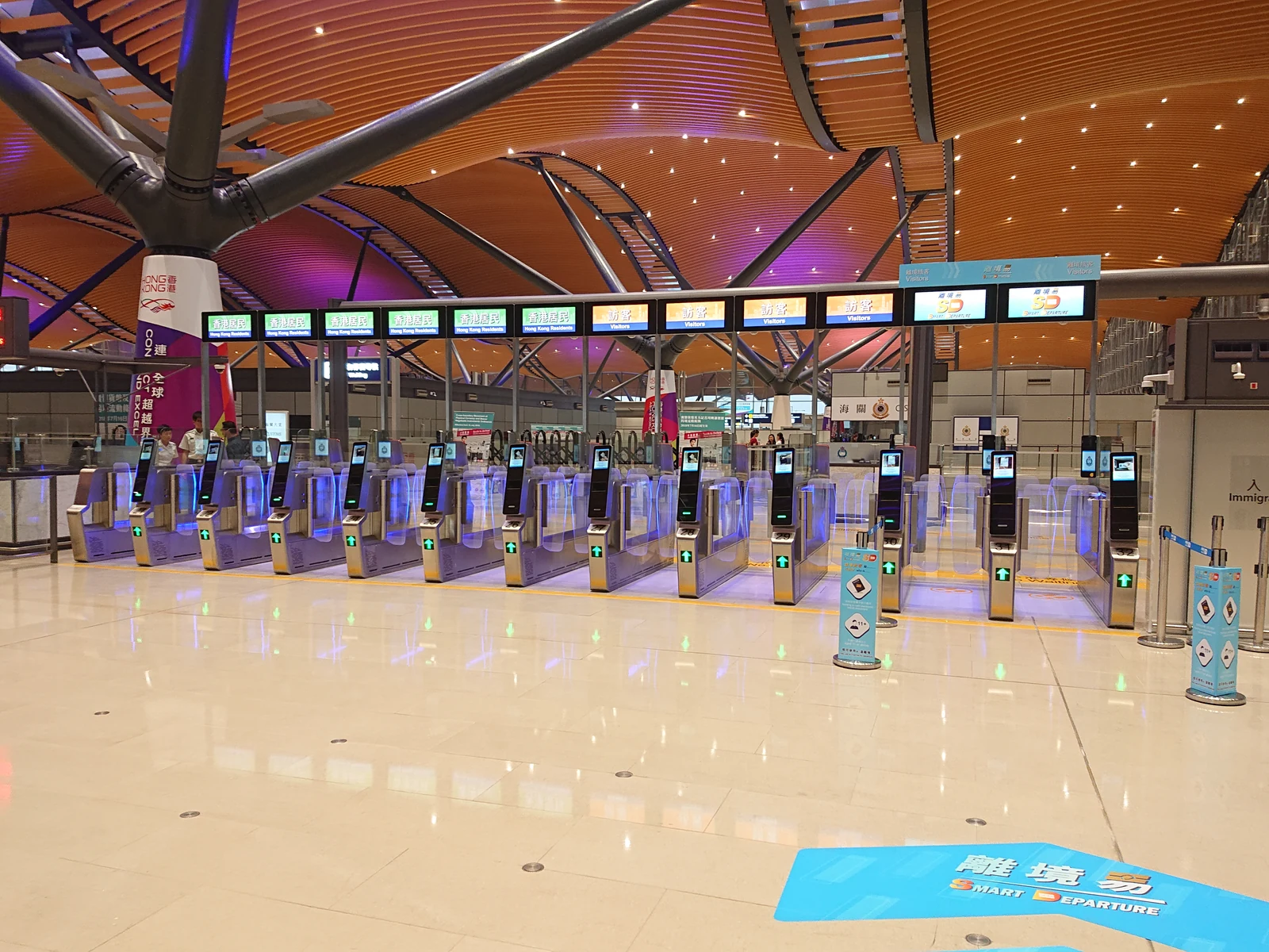 Different automated clearance lanes and signs at the HZMB Hong Kong Port