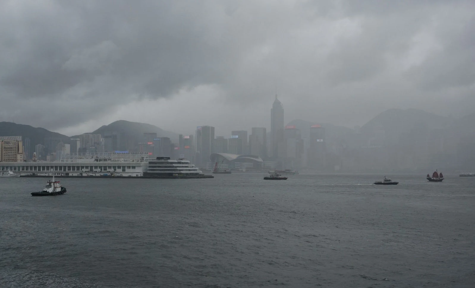 Victoria Harbour with distant buildings obscured by rain