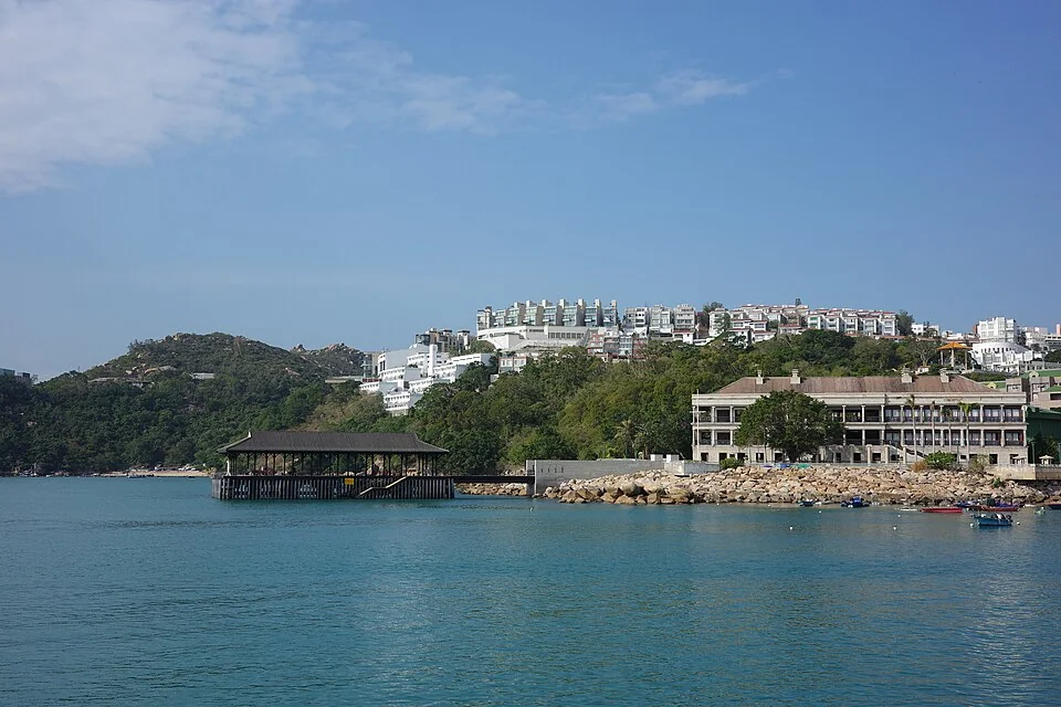 Blake Pier’s iron roof and three-storey Murray House beside Stanley Bay