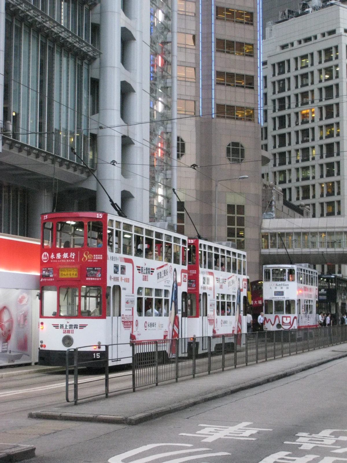 Double-decker trams and a central street stop in Central