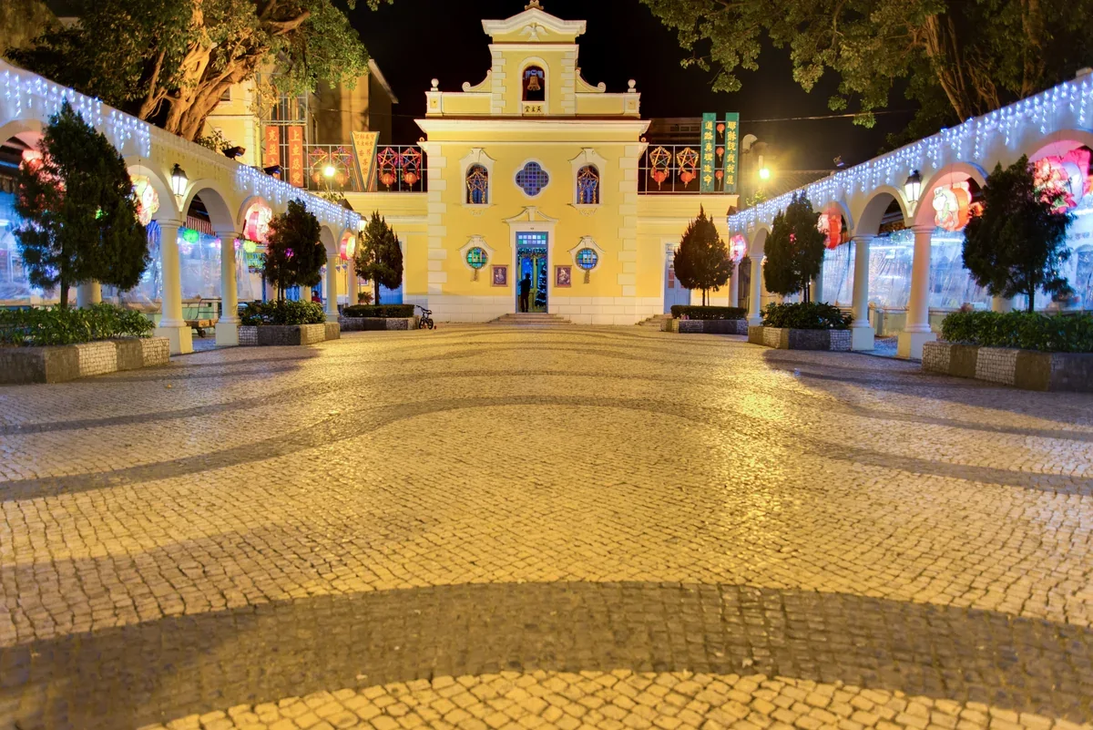 Night view of the Chapel of St Francis Xavier and its square in Coloane